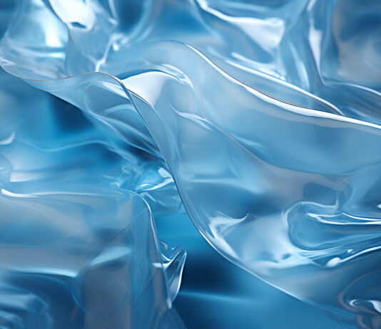 watttron sichert sich 12 Millionen Euro Serie-B-Finanzierung Symbolbild. Transparent plastic wrap on dark and blue background. Clean blank texture overlay effect template. Isolated wrinkle surface branding mock-up. Copyright: annebel146 - stock.adobe.com