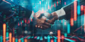 Symbolbild "Reverse Merger". (Business handshake on finance prosperity). Copyright: The Little Hut - stock.adobe.com