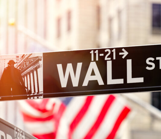 Wall Street in New York City at sunset