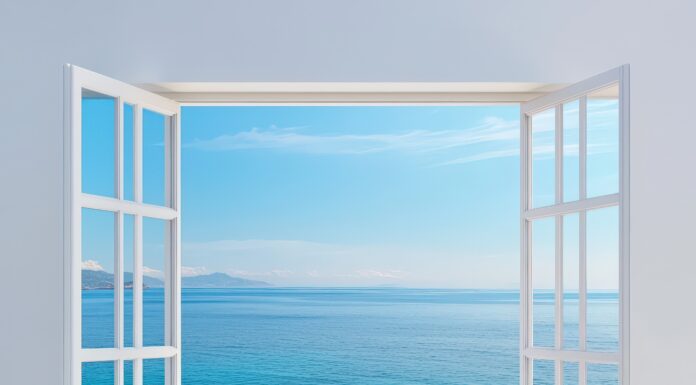 A bright and airy image of an open window showcasing a stunning seaside view. The tranquil blue ocean and clear sky create a perfect escape into ... Copyright: CHA - stock.adobe.com