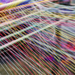 Symbolbild. Loom weaving colors threads : Closeup. Copyright: Prin - stock.adobe.com