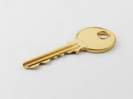 Symbolbild. Shiny golden key on a white background, symbolizing success, new opportunities, and important decisions. Copyright: Helena - stock.adobe.com
