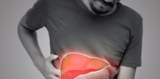 Symbolbild. The illustration of liver is on the man's body against gray background. A men with hepatitis and fatty liver problem. Copyright: eddows - stock.adobe.com