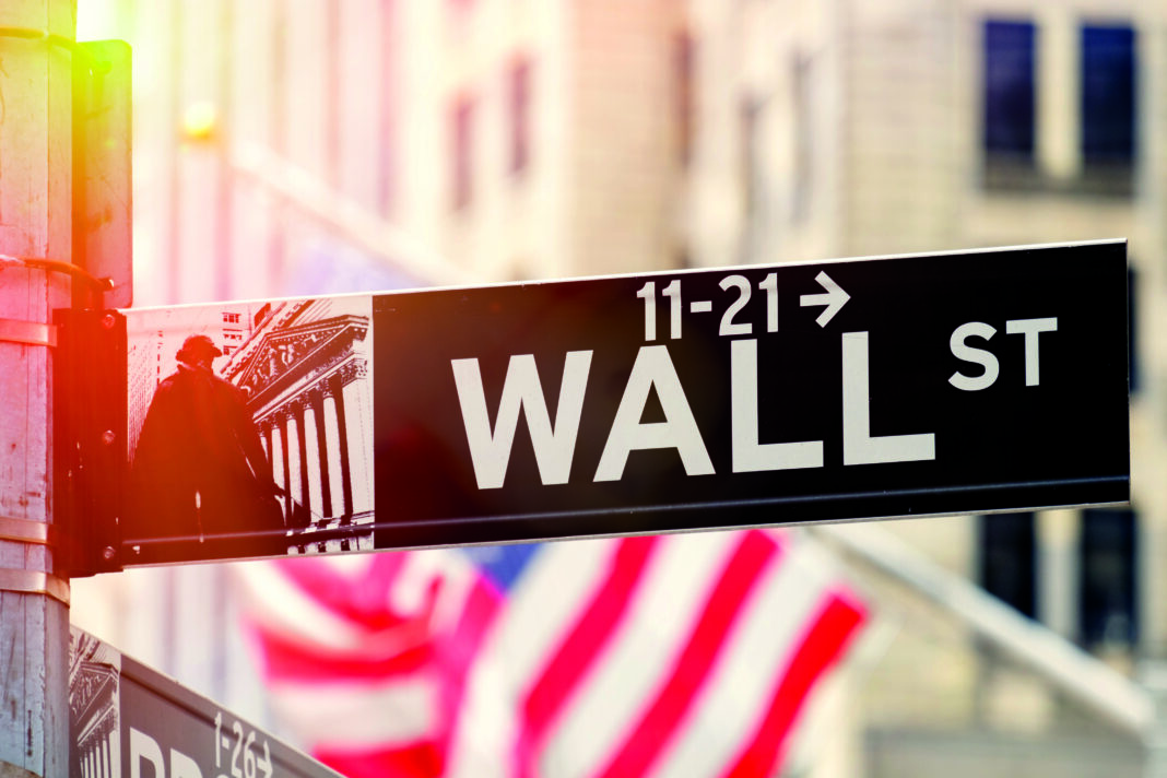 Wall Street in New York City at sunset